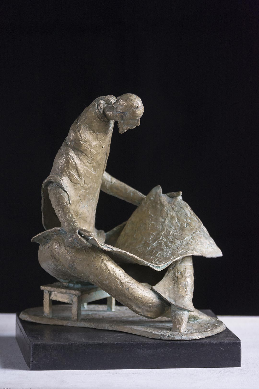 Figurative Sculpture with Bronze"Reader" art by Prabir Roy