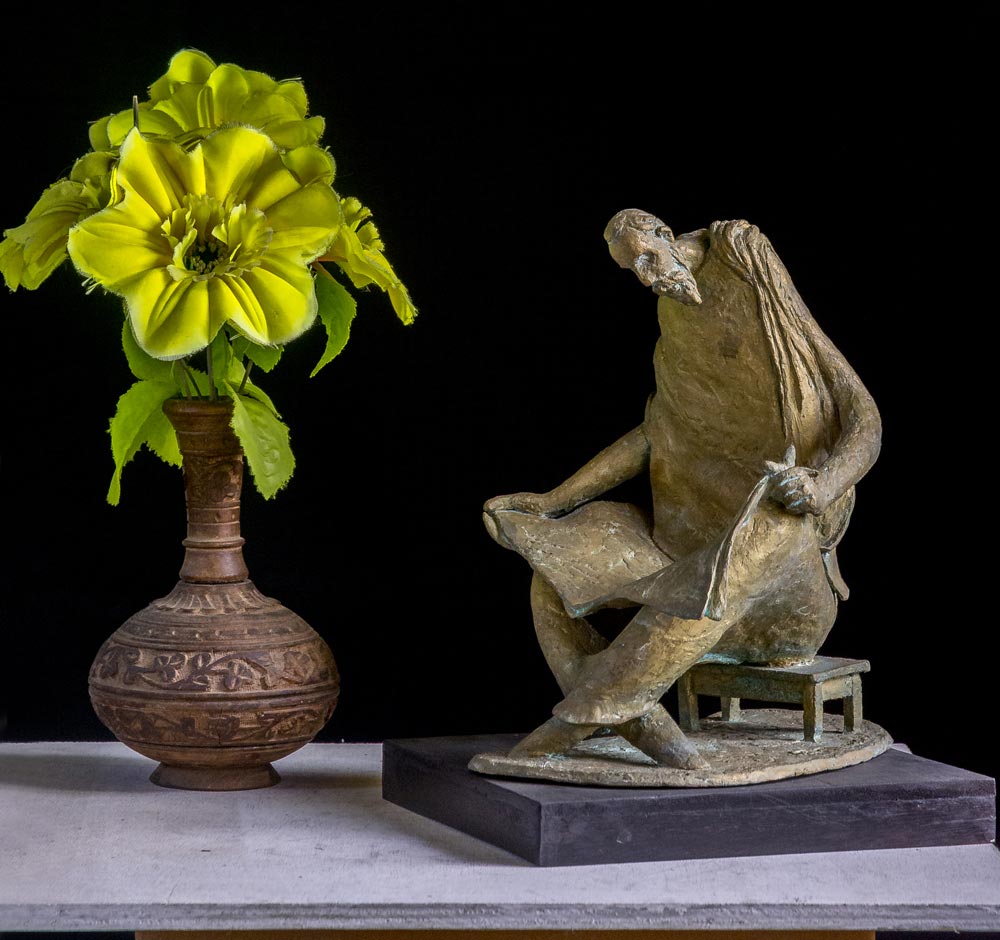 Figurative Sculpture with Bronze"Reader" art by Prabir Roy